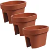 Three terracotta-colored oval balcony planters are arranged in a staggered formation against a white background. Anteprima dell’immagine prodotto