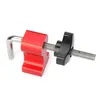 A close-up studio shot of a red and black woodworking clamp against a white background. Náhled obrázku produktu