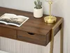 A close-up view of a wooden desk with drawers, a book, a potted cactus, and a lamp. Anteprima dell’immagine prodotto