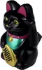 A black lucky cat figurine with a gold coin and a teal and pink collar, shown against a white background. Produktbild-Vorschau
