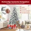A decorated artificial Christmas tree in a living room setting, surrounded by gifts and a reindeer decoration. Anteprima dell’immagine prodotto