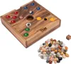 A wooden board game with colorful stones and a die. Produktbild-Vorschau