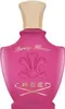 A pink perfume bottle with a gold cap. Anteprima dell’immagine prodotto