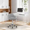 A modern home office setup with a desk, computer, lamp, and a gray office chair. Produktbild-Vorschau