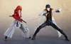 Two action figures of anime characters are posed in a dynamic stance, holding swords. Produktbild-Vorschau