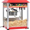 A popcorn machine filled with popcorn, with a cartoon character on the front. Voir les images du produit