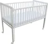 A white baby crib with a mattress inside, shown from a side angle on a white background. Produktbild-Vorschau