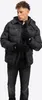 A man wearing a black puffer jacket and black jeans, with black gloves on. Produktbild-Vorschau