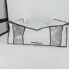 A white storage bag with gray trim and clear plastic windows is shown against a white background. The word 'compactor' is visible on the front of the bag. Anteprima dell’immagine prodotto