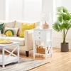 Living room scene with a sofa, side table, and plant. Podgląd zdjęcia produktu