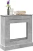 A concrete-effect fireplace surround with decorative items on top. Podgląd zdjęcia produktu