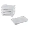 A stack of white pet water filters and one filter placed separately on a white background. Voir les images du produit