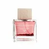 A bottle of perfume on a white background. Voir les images du produit