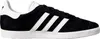 A side view of a black Adidas Gazelle sneaker with white stripes and sole. Produktbild-Vorschau