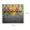 A collection of wooden spoons filled with various colorful spices and herbs, arranged on a dark, textured surface. Podgląd zdjęcia produktu