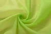 A close-up of swirled, sheer lime green fabric. Produktbild-Vorschau