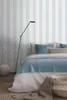 A bedroom scene with a bed, lamp, and vase. Produktbild-Vorschau