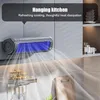 A kitchen environment with a wall-mounted fan and shelves with jars and utensils. Anteprima dell’immagine prodotto