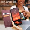 A person is using a phone case with card slots to pay for something at a terminal. Produktbild-Vorschau