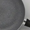 Close-up of the speckled interior of a frying pan. Produktbild-Vorschau