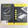 Two boxes of a USB-C hub adapter are shown side-by-side. Produktbild-Vorschau