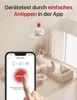 A smartphone screen displaying a smoke detector app interface, with a smoke detector device shown on a ceiling in the background, and a living room scene with a person on a couch. Náhľad obrázku produktu