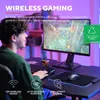 A young person is playing a video game on a computer, with a wireless mouse and keyboard on the desk. Produktbild-Vorschau