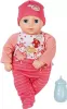 A baby doll dressed in pink clothing, with a pink hat and a blue bottle accessory. Náhľad obrázku produktu
