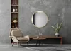 A modern living room setting with a chair, mirror, and plant. Náhled obrázku produktu
