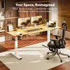 A modern home office setup with a standing desk, monitors, laptop, and chair. Produktbild-Vorschau