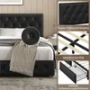 A collage of images showing details of a black upholstered bed frame, including the headboard, wooden slats, and storage drawer. Produktbild-Vorschau