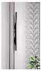 A side view of a black TV wall mount attached to a wall, with a patterned wallpaper in the background. Anteprima dell’immagine prodotto