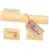 A set of brass-colored door handles and rosettes on a white background. Produktbild-Vorschau