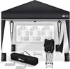 A black pop-up gazebo with its frame, carrying bag, and accessories laid out in front of a white wall with a decorative window. Anteprima dell’immagine prodotto
