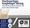 A mattress topper with care instructions and certifications displayed. Produktbild-Vorschau