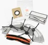 A collection of robot vacuum cleaner accessories, including filters, dust bags, side brushes, and a main brush roll, laid out on a white background. Náhled obrázku produktu