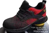A close-up studio shot of a black and red safety shoe. Produktbild-Vorschau