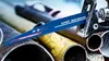 A close-up shot of a reciprocating saw blade with text and logos, resting on several metal pipes. Náhľad obrázku produktu