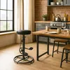 A bar stool and dining table in a kitchen setting. Produktbild-Vorschau