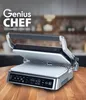 A Genius Chef Cerafit Edition contact grill is shown open on a wooden table, with a blurred kitchen background. Produktbild-Vorschau