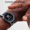 A person's wrist wearing a smartwatch, with instructions on the screen. Podgląd zdjęcia produktu