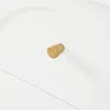 A close-up shot of a white drawer with a gold knob. Anteprima dell’immagine prodotto