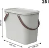 A light gray storage box with a lid and brown handles is shown against a white background. Dimensions are indicated by measurement lines and text. Voir les images du produit