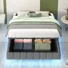 A bed with storage underneath, shown in a bedroom setting with decorative pillows and blankets. Podgląd zdjęcia produktu