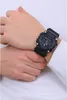 A close-up shot of a person's wrist wearing a black digital watch. Produktbild-Vorschau