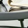 A close-up of a bistro set with a book on top. Náhľad obrázku produktu