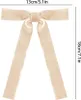 A beige velvet bow with two long streamers, shown against a white background with size indicators. Voir les images du produit