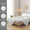 A bed with a light gray quilted blanket laid out, showing different available sizes on the left side. Produktbild-Vorschau