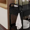 A close-up view of a black multi-purpose cart with a white towel hanging from one of its hooks. Produktbild-Vorschau