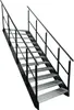 A metal staircase with metal grating steps and handrails, isolated on a white background. Podgląd zdjęcia produktu